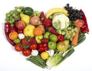 Image of Fruit and Vegetables in the shape of a heart. 